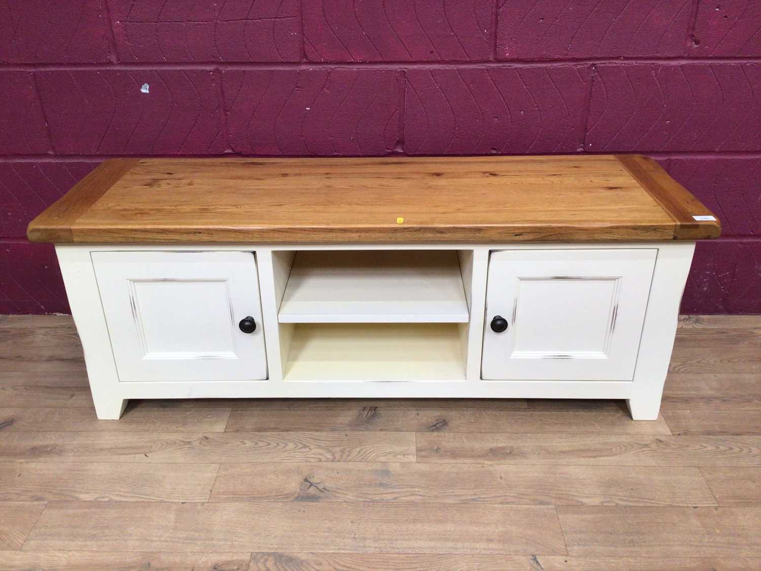 Lot 376 - Contemporary white painted and pine television unit together with a similar table (2)