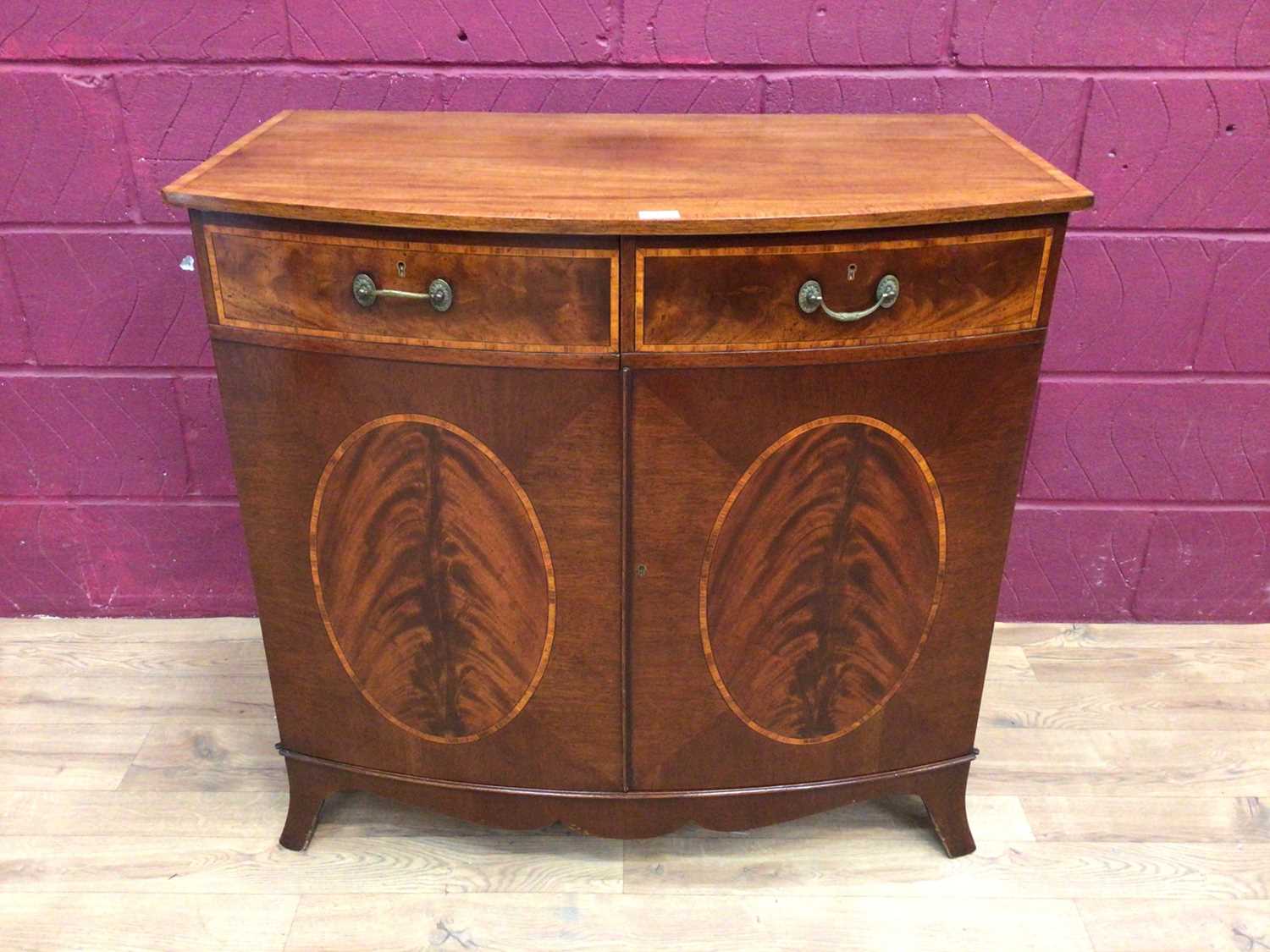 Lot 384 - Fine quality bowfront mahogany cabinet with Belling warming oven