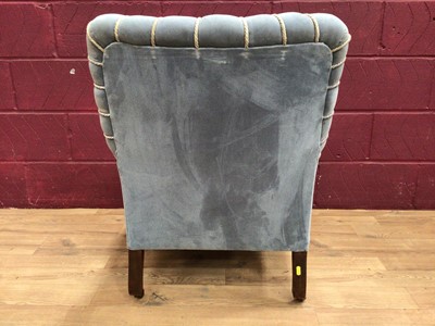 Lot 317 - Victorian easy chair upholstered in pale blue Drayson, on turned legs with brass castors.