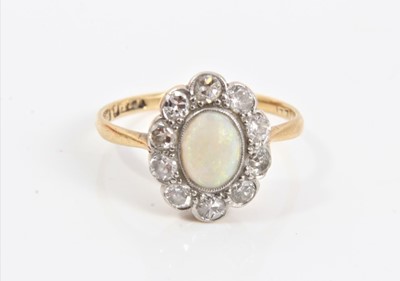 Lot 78 - Edwardian 18ct gold opal and diamond cluster ring in millegrain setting, size K½