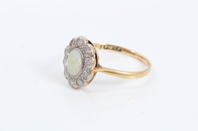 Lot 78 - Edwardian 18ct gold opal and diamond cluster ring in millegrain setting, size K½