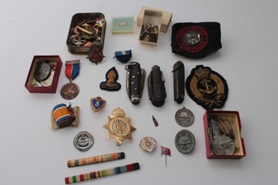 Lot 650 - Collection of cap badges, mounted medal ribbons, Nazi wound badge, three military knives and other badges and militaria (1 box)