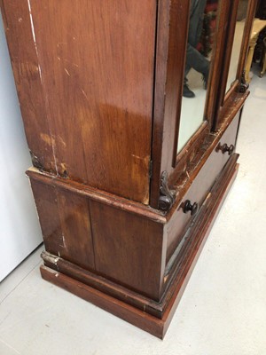 Lot 11 - Victorian mahogany double wardrobe with two arched mirror doors and drawer below, 127cm wide x 57cm deep x 211cm high