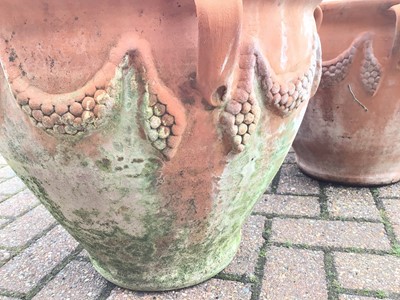 Lot 55 - Five similar terracotta garden urns with swag decorations approx 39cm height x 47cm diameter and a similar smaller terracotta urn 35cm height x 37cm diameter