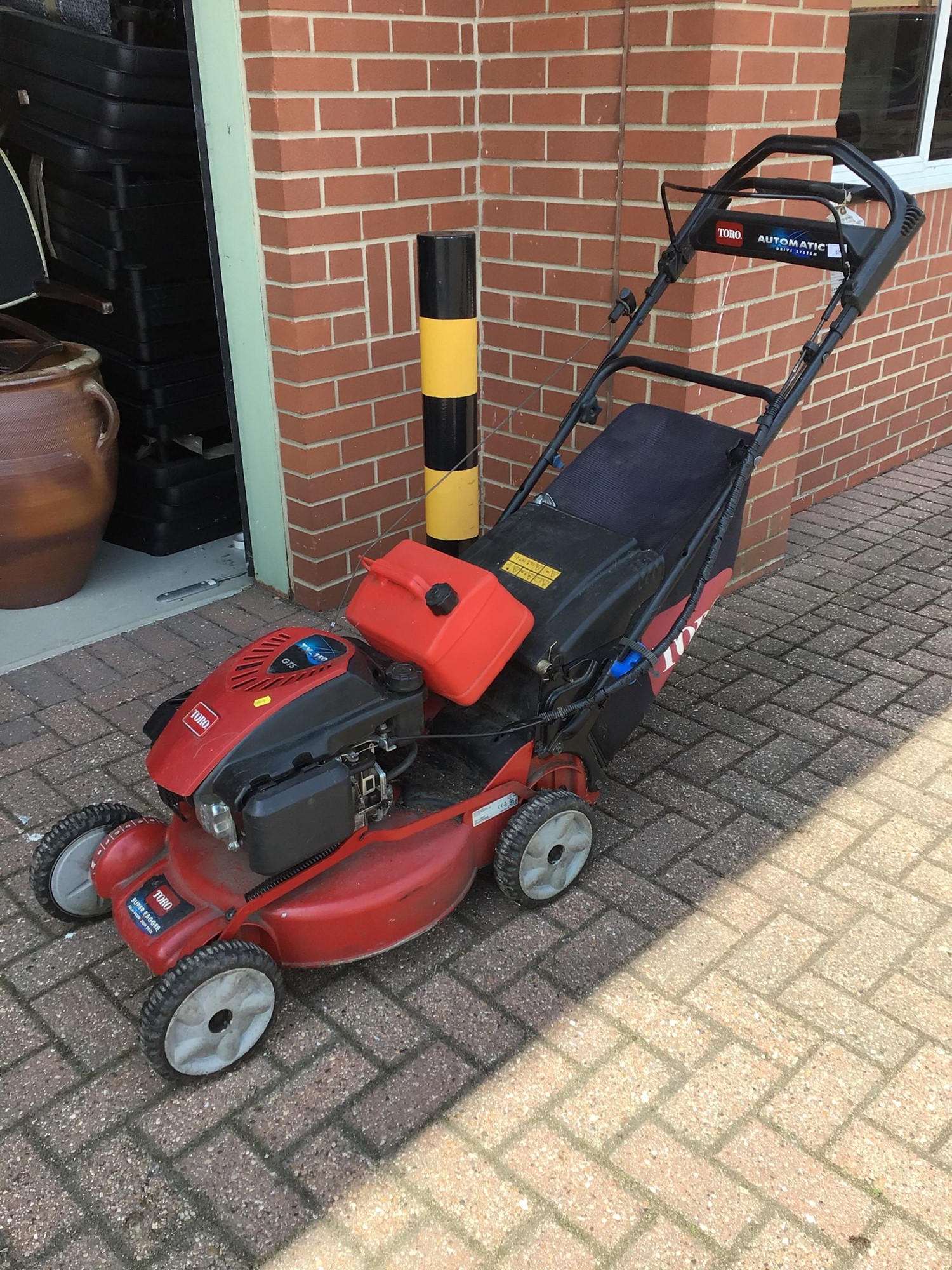 Lot 57 Toro TX 159 petrol lawn mower with grass