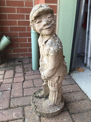 Lot 58 - Concrete garden ornament of a boy playing cricket 66cm high