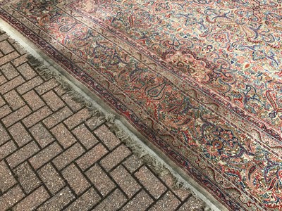 Lot 1560 - Large Persian carpet with geometric decoration on red, blue and cream ground 410cm x 630cm