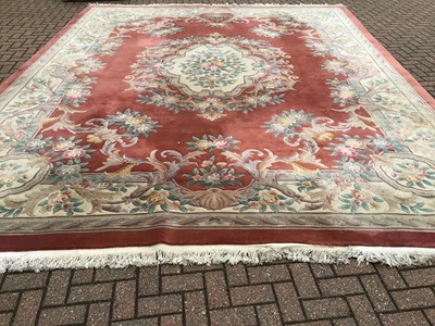 Lot 984 - Large Chinese was rug with floral decoration on terracotta and cream ground 367cm x 470cm