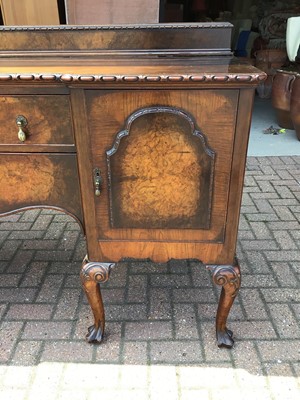 Lot 62 - Good quality walnut sideboard with raised ledge back, two central drawers below flanked by cupboards on carved cabriol legs 183cm wide x 58cm deep x 110cm high