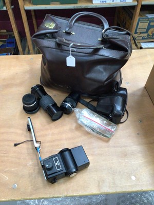 Lot 2159 - Olympus OM-1, lenses and other accessories in leather bag