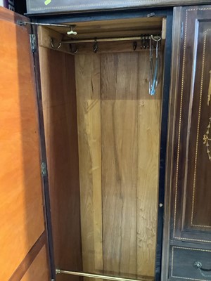 Lot 82 - Edwardian inlaid mahogany wardrobe with two central panelled doors and four draws below flanked by two bevelled mirrored doors 193.5cm wide x 203cm high
