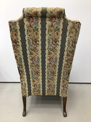 Lot 39 - Good quality Georgian style wing back armchair with floral upholstery on carved mahogany legs with claw and ball feet