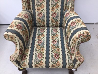 Lot 39 - Good quality Georgian style wing back armchair with floral upholstery on carved mahogany legs with claw and ball feet