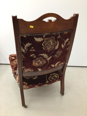 Lot 41 - Edwardian walnut framed easy chair with upholstered seat and back on turned front legs and castors
