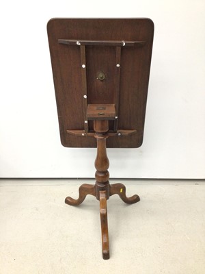 Lot 45 - 19th century mahogany wine table with tilt top on turned column and three hipped splayed legs 66.5cm wide x 46cm