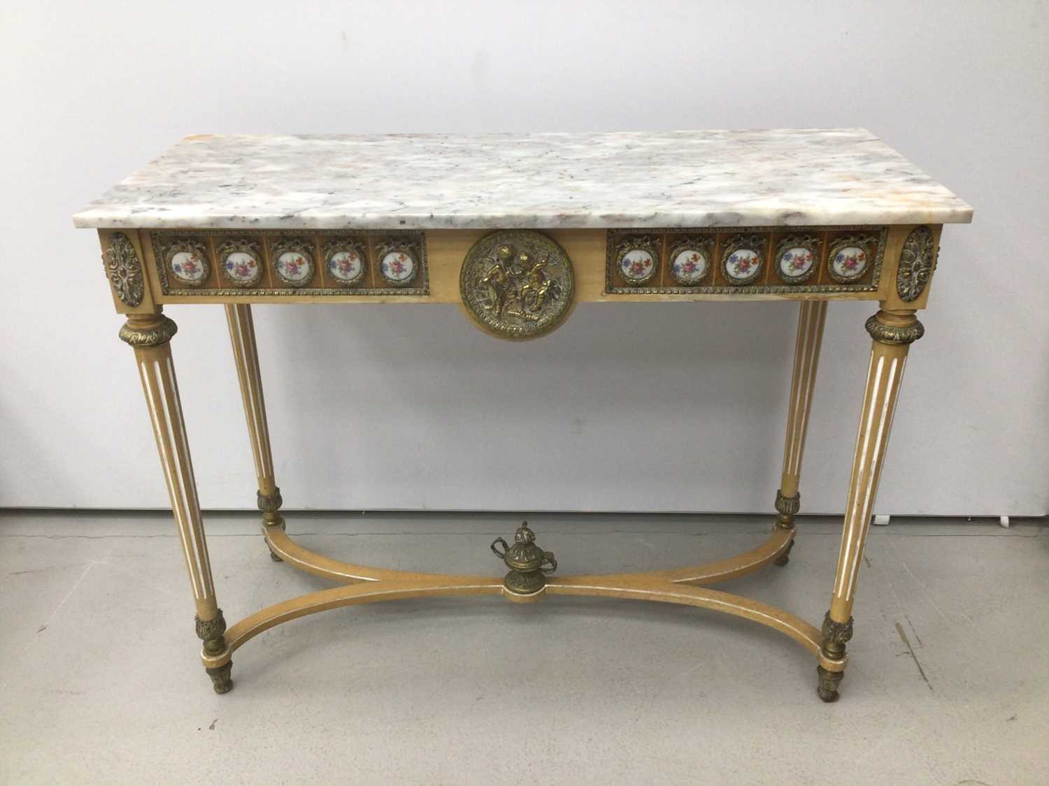 Lot 87 - Antique style hall table with marble top, frieze inset with porcelain plaques on fluted turned legs joined by stretchers 107cm wide x 43cm deep x 83cm high