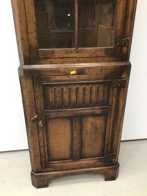 Lot 88 - Antique style oak two height corner cupboard with glazed door above and panel door below 61cm wide x 179cm high