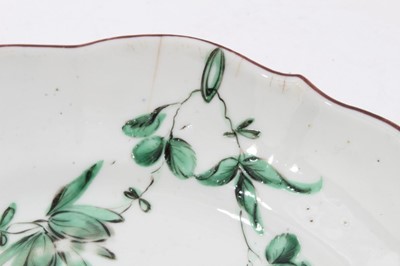 Lot 178 - Bristol saucer dish, circa 1775, decorated with floral swags in green monochrome, the scalloped rim painted, B mark to base, 18.5cm diameter