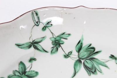 Lot 178 - Bristol saucer dish, circa 1775, decorated with floral swags in green monochrome, the scalloped rim painted, B mark to base, 18.5cm diameter