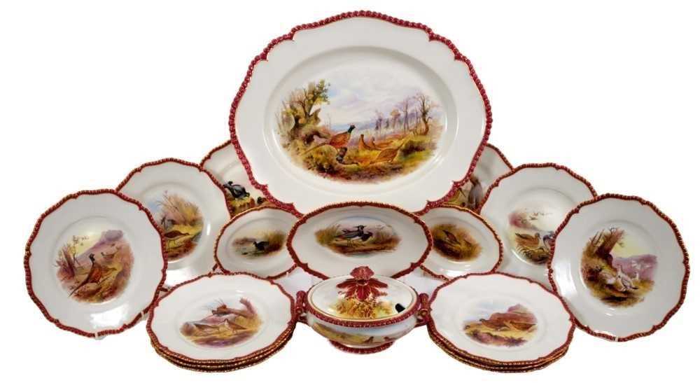 Lot 189 - Fine quality Royal Worcester sporting service, painted with various British birds, with maroon and gilt patterned rims, to include a platter, tureen and stand, two small serving dishes and twelve p...