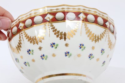 Lot 180 - Pinxton porcelain bowl, c.1800, of round faceted form, decorated in enamels and gilt with swags and floral sprays, 16cm diameter