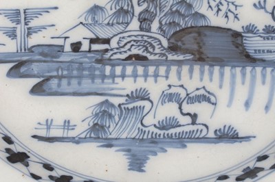 Lot 184 - 18th century English delftware charger, painted in underglaze blue with an island pattern, 34.5cm diameter