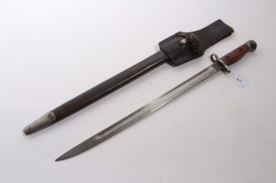 Lot 877 - First World War 1907 pattern bayonet, with fullered blade stamped Sanderson, in steel mounted leather scabbard with frog