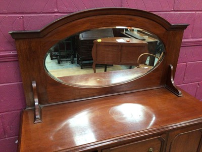 Lot 340 - 1920's mahogany sideboard with raised bevelled mirror back, two central drawers below flanked by cupboards on cabriole legs, 136cm wide, 51cm deep, 165cm high