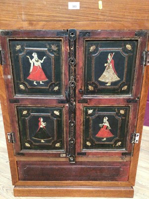 Lot 353 - Eastern camphor wood cabinet with rising hinged lid, two painted panelled doors below depicting Indian figures, 61cm wide, 48.5cm deep, 90cm high