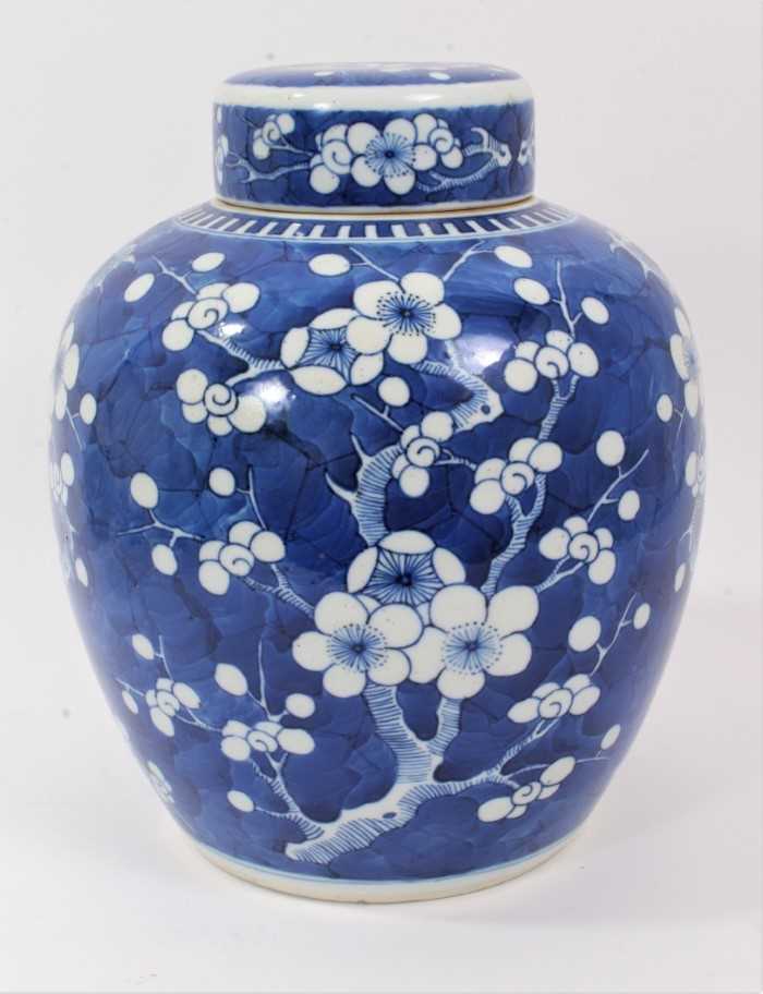 Lot 187 - Chinese blue and white porcelain ginger jar and cover, c.1900, decorated with prunus blossom, double-ring mark to base, 25.5cm high