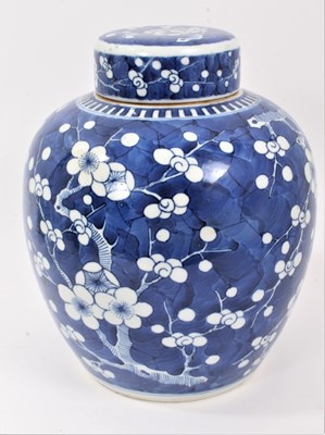 Lot 187 - Chinese blue and white porcelain ginger jar and cover, c.1900, decorated with prunus blossom, double-ring mark to base, 25.5cm high
