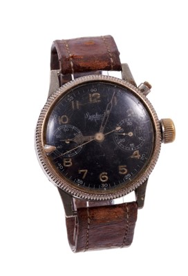 Lot 701 - Rare WWII German Luftwaffe aviator's military wristwatch by Hanhart, the pilot's chronograph with rotating milled bezel and arrow marker, the circular black dial with two subsidiary dials, luminous...