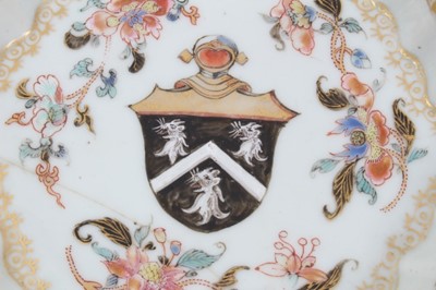 Lot 197 - 18th century Chinese famille rose armorial teapot stand, the centre painted with the armorial, surrounded by floral sprays and gilt patterns, 14cm across