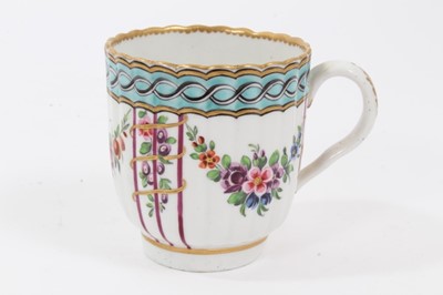Lot 198 - Worcester coffee cup, c.1780, of fluted form, polychrome decorated with floral swags, and a chain link pattern on a light blue ground, 6.75cm high