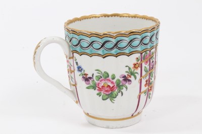 Lot 198 - Worcester coffee cup, c.1780, of fluted form, polychrome decorated with floral swags, and a chain link pattern on a light blue ground, 6.75cm high