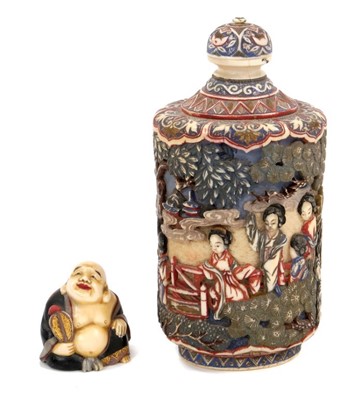 Lot 817 - Finely carved and polychrome stained Chinese ivory snuff bottle and cover, together with a small carved and lacquered Buddha figure