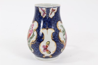 Lot 196 - Worcester milk jug, c.1770, polychrome decorated with exotic birds and insects within scrolled cartouches, on a blue scale ground, pseudo-Chinese mark to base, 9.75cm high