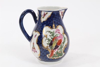 Lot 196 - Worcester milk jug, c.1770, polychrome decorated with exotic birds and insects within scrolled cartouches, on a blue scale ground, pseudo-Chinese mark to base, 9.75cm high
