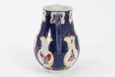 Lot 199 - Worcester milk jug, c.1770, polychrome decorated with exotic birds and insects within scrolled cartouches, on a blue scale ground, pseudo-Chinese mark to base, 9.75cm high