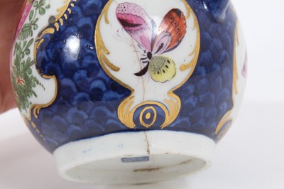 Lot 199 - Worcester milk jug, c.1770, polychrome decorated with exotic birds and insects within scrolled cartouches, on a blue scale ground, pseudo-Chinese mark to base, 9.75cm high