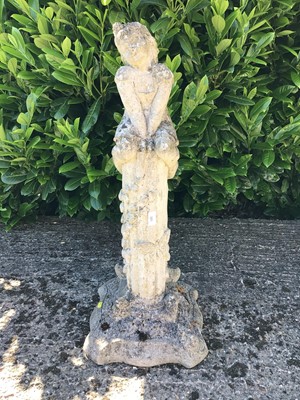 Lot 385 - Concrete garden statue of a young girl seated on a column, 84cm high