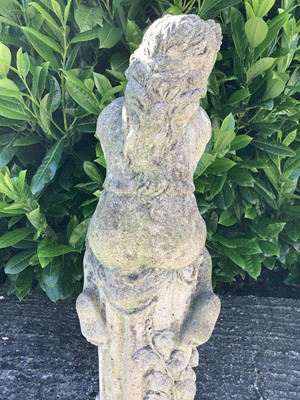 Lot 385 - Concrete garden statue of a young girl seated on a column, 84cm high