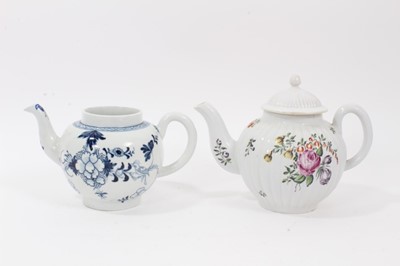 Lot 201 - Derby teapot, c.1756, of fluted form, polychrome painted with flowers (replacement cover) and a Liverpool teapot, painted in blue with flowers and birds (2)