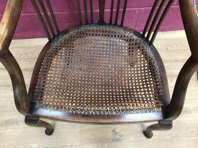 Lot 390 - Edwardian mahogany tub chair with caned seat and a mahogany framed oval wall mirror (2)