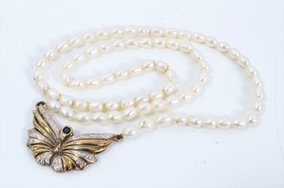 Lot 126 - Cultured pearl necklace with 9ct gold sapphire and diamond set butterfly pendant