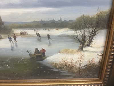 Lot 135 - P. Rush, 20th century, oil on panel - Dutch winter landscape with figures on a frozen lake, signed, in gilt frame