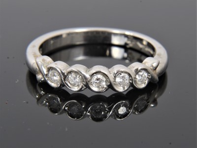 Lot 129 - Platinum diamond five stone half eternity ring
