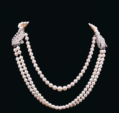 Lot 526 - Art Deco style diamond and cultured pearl necklace with three strings of graduated cultured pearls measuring approximately 8.4mm to 6mm, suspended from a pair of Art Deco diamond double clips with...