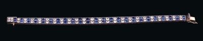 Lot 531 - Art Deco sapphire and white stone bracelet with pairs of round mixed cut stones in an alternating design. Length approximately 17.5cm.