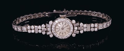 Lot 532 - 1960s ladies diamond and platinum cocktail bracelet wristwatch with manual wind movement by Vertex, the diamond bezel with baguette cut and brilliant cut diamonds to the shoulders on an articulated...